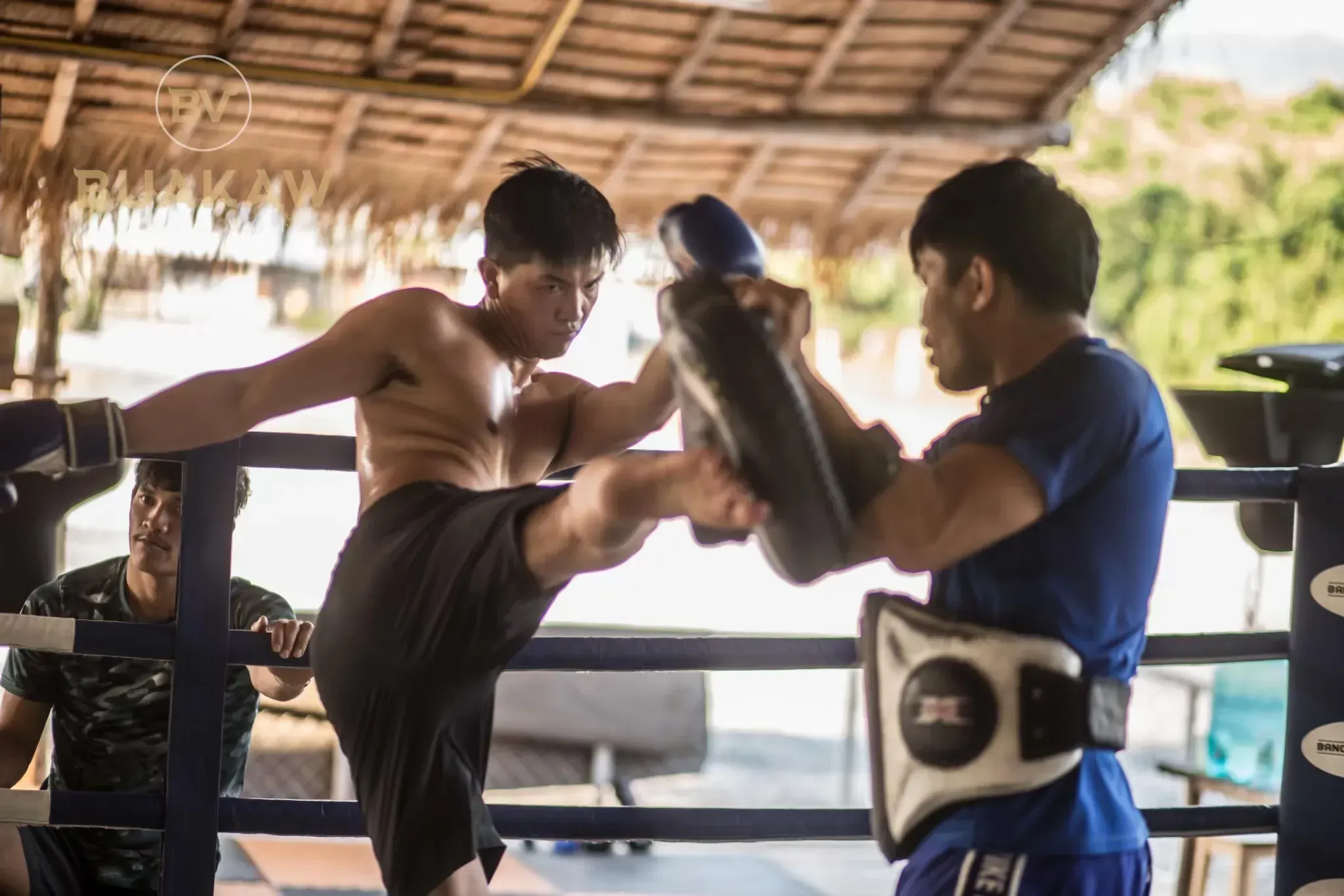 Group training at Banchamek Gym, where Muay Thai students from around the world sharpen their skills through partner drills and sparring in Chiang Mai.