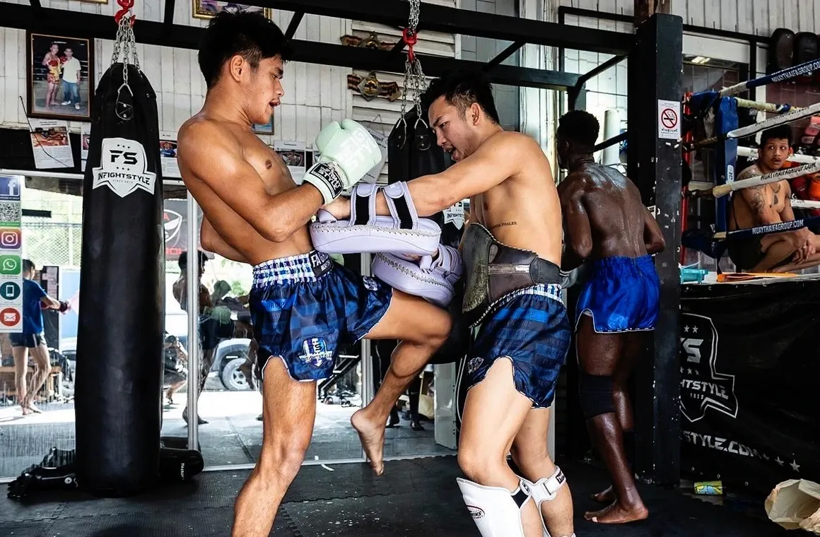 Advanced Muay Thai training at FA Group Muaythai Gym with experienced coaches helping fighters sharpen their skills and ring performance.