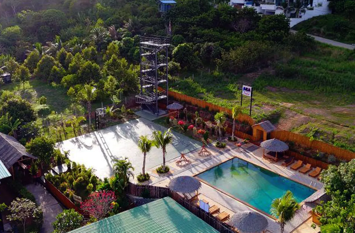 A stunning aerial view of AKA Thailand shows its world-class Muay Thai rings, fitness facilities, and relaxing pool area—an ideal destination for travelers training in paradise.
