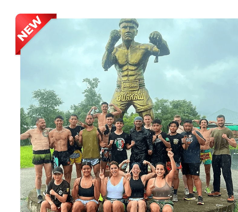Buakaw standing proudly with his international students in front of the Gym.