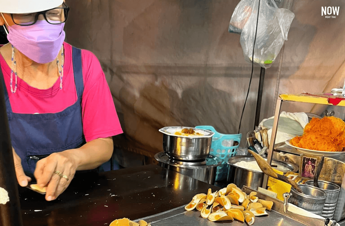 Vendor making traditional Thai coconut pancakes at the Hua Hin Night Market