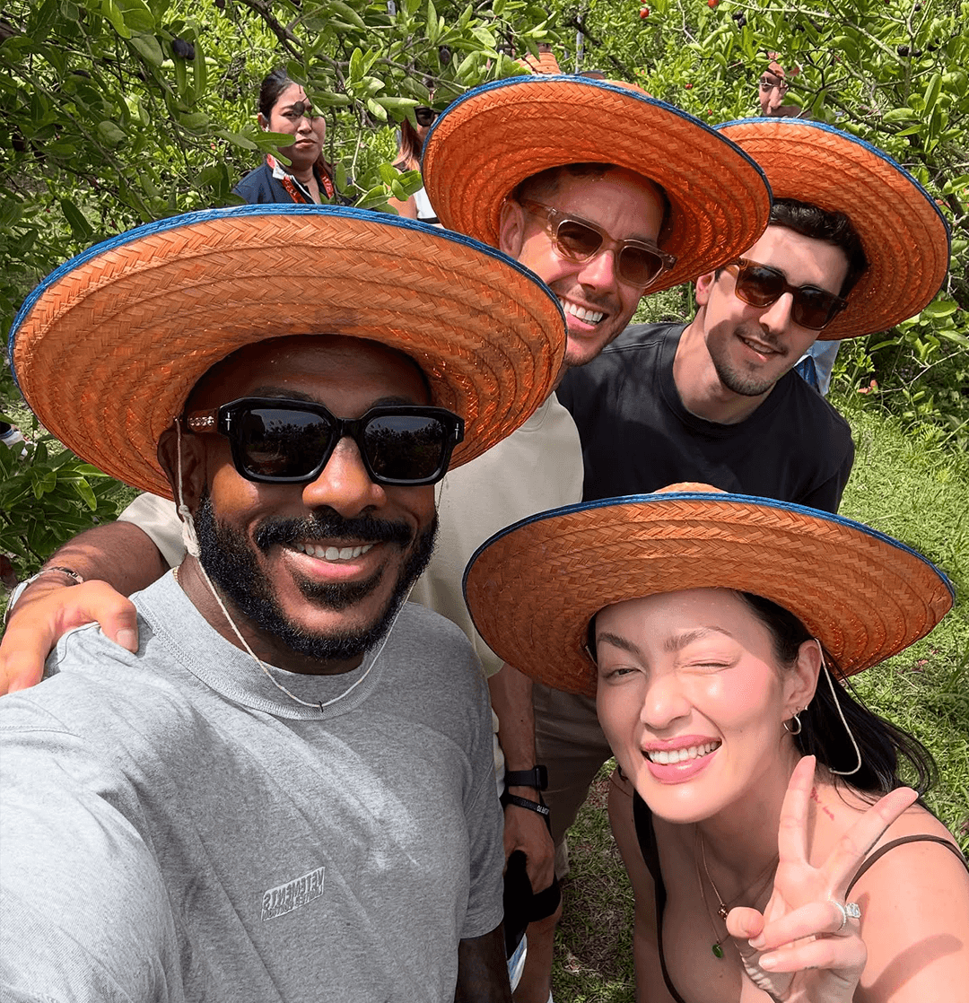 A relaxed selfie of Khalil with his wife and friends while exploring a tropical fruit orchard in Samut Songkhram.