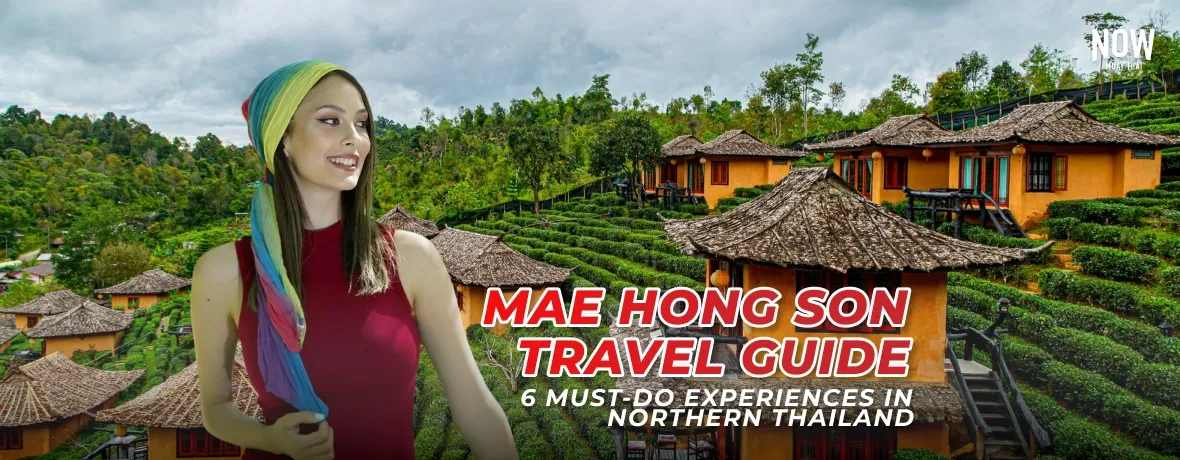 Mae-Hong-Son-cover-A beautiful photo of Ban Rak Thai village in Mae Hong Son, Thailand, showing traditional Yunnanese-style houses surrounding a calm lake, with green tea plantations on the terraced hillsides, often covered in morning mist and on the left there is a girl with colourful headware and a red tank top, smiling and looking at the houses.