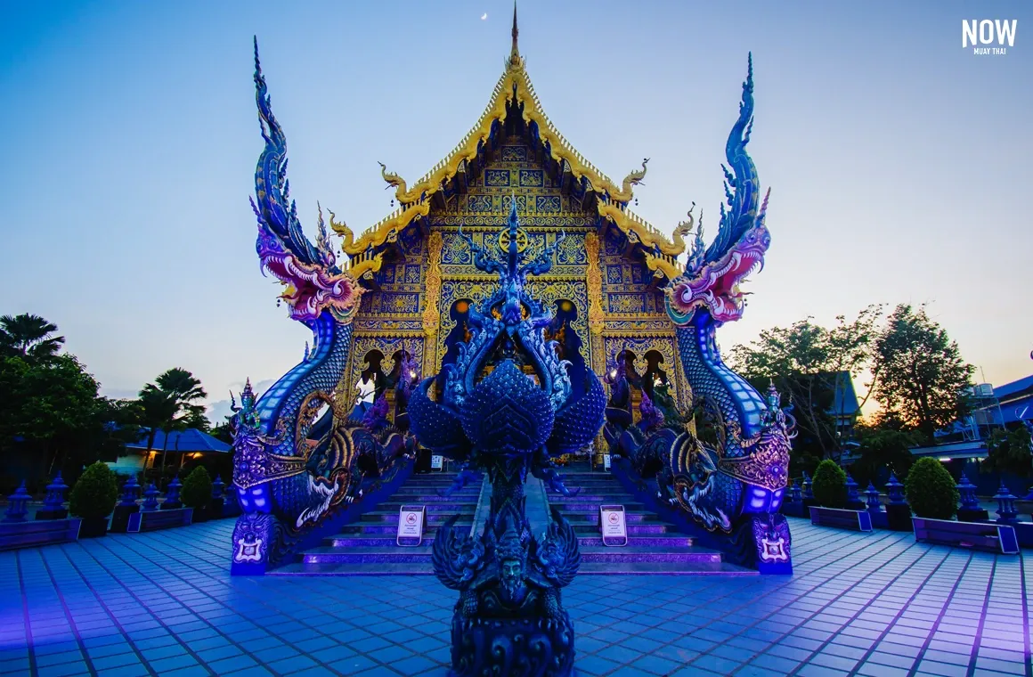 Wat Rong Suea Ten, Blue Temple, Chiang Rai, Thailand, vibrant blue and gold architecture, intricate details, modern Thai art, spiritual landmark, tourist attraction, travel photography.