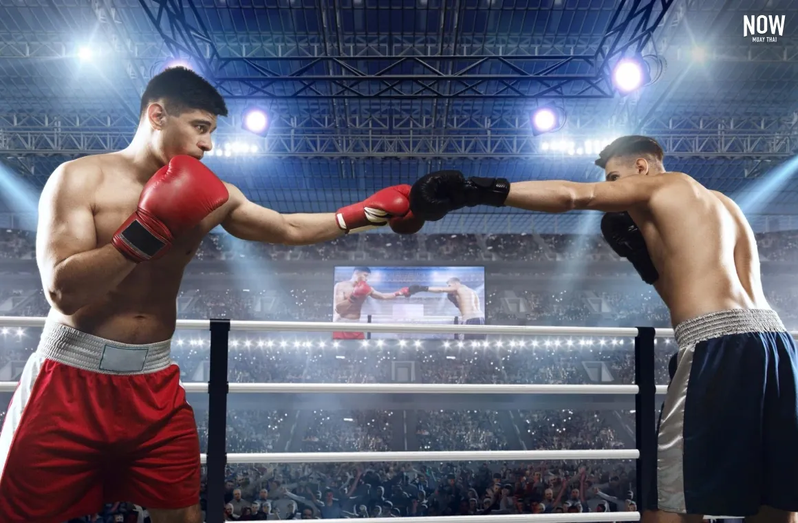 Two fighters at the ring greeting each other before the start of a muay thai boxing fight