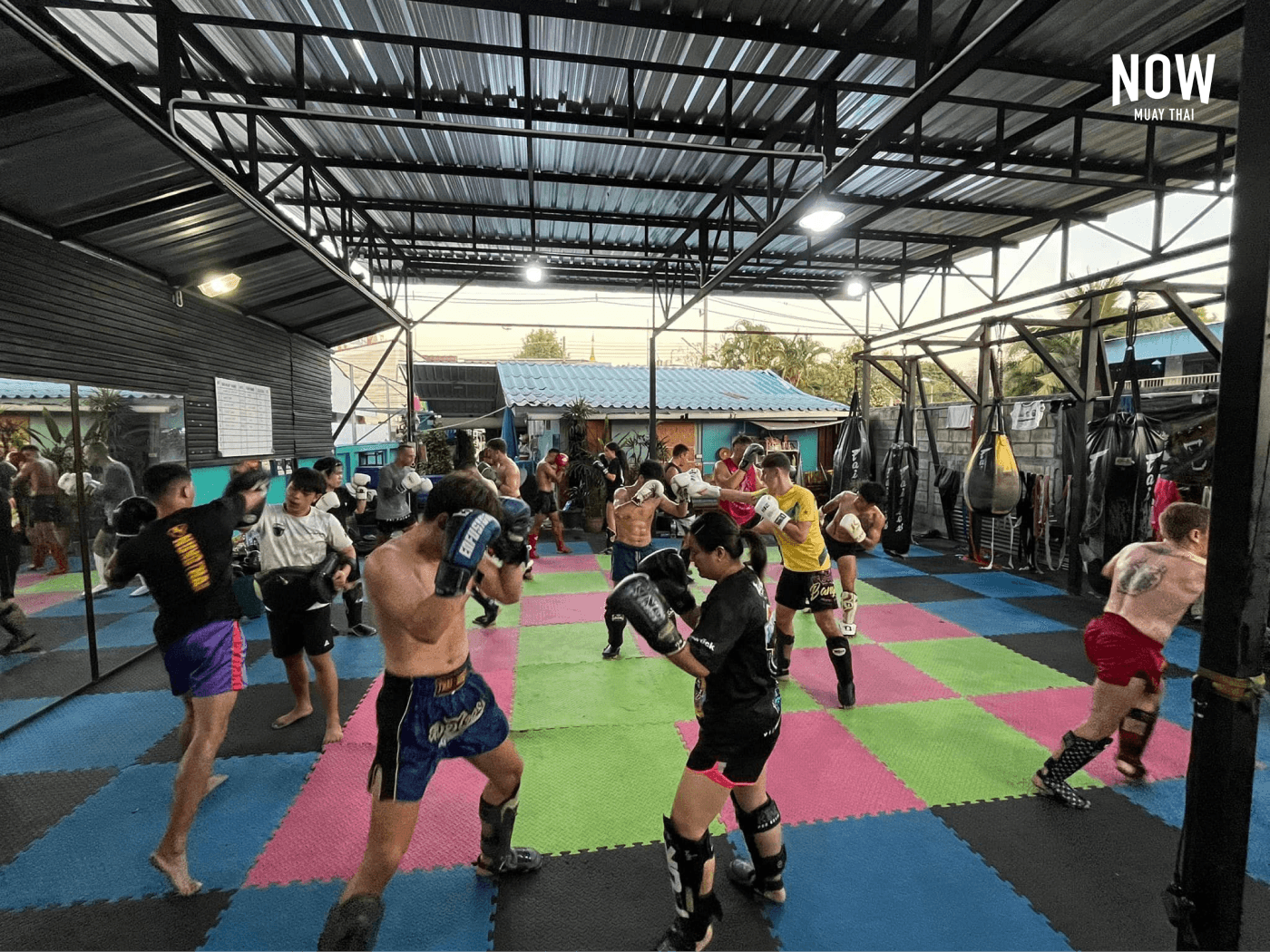 People doing fitness exercises at the Bear Fight Club Muay Thai Gym in Chiang Mai