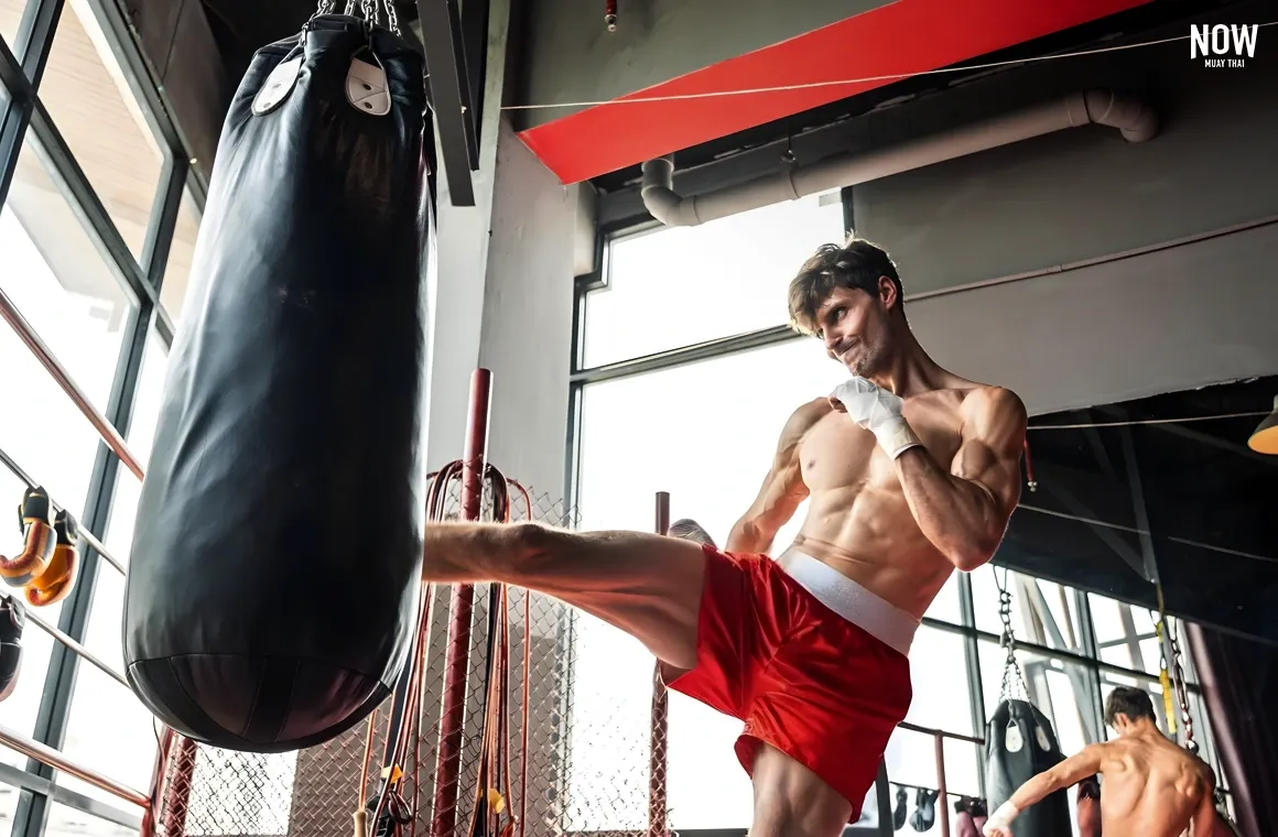 A man intensely focused on his Muay Thai workout, symbolizing how Hollywood celebrities travel to Thailand to experience authentic Muay Thai training. Many stars embrace the discipline and mental toughness of Muay Thai, finding not only physical conditioning but also a deeper cultural and spiritual connection with the martial art.