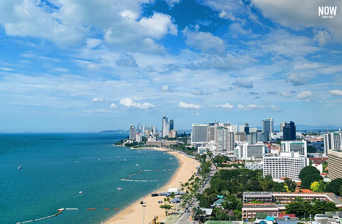 Aerial view of Pattaya Beach, showcasing the expansive coastline, turquoise sea, sandy beach, and the vibrant cityscape of Pattaya.
