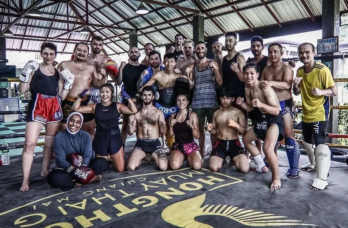 Group photo of a Muay Thai class at Hongthong Muay Thai gym in Chiang Mai, showcasing long-term package options. Many gyms offer flexible pricing, allowing you to try a short session first before committing to a full package if it's the right fit.