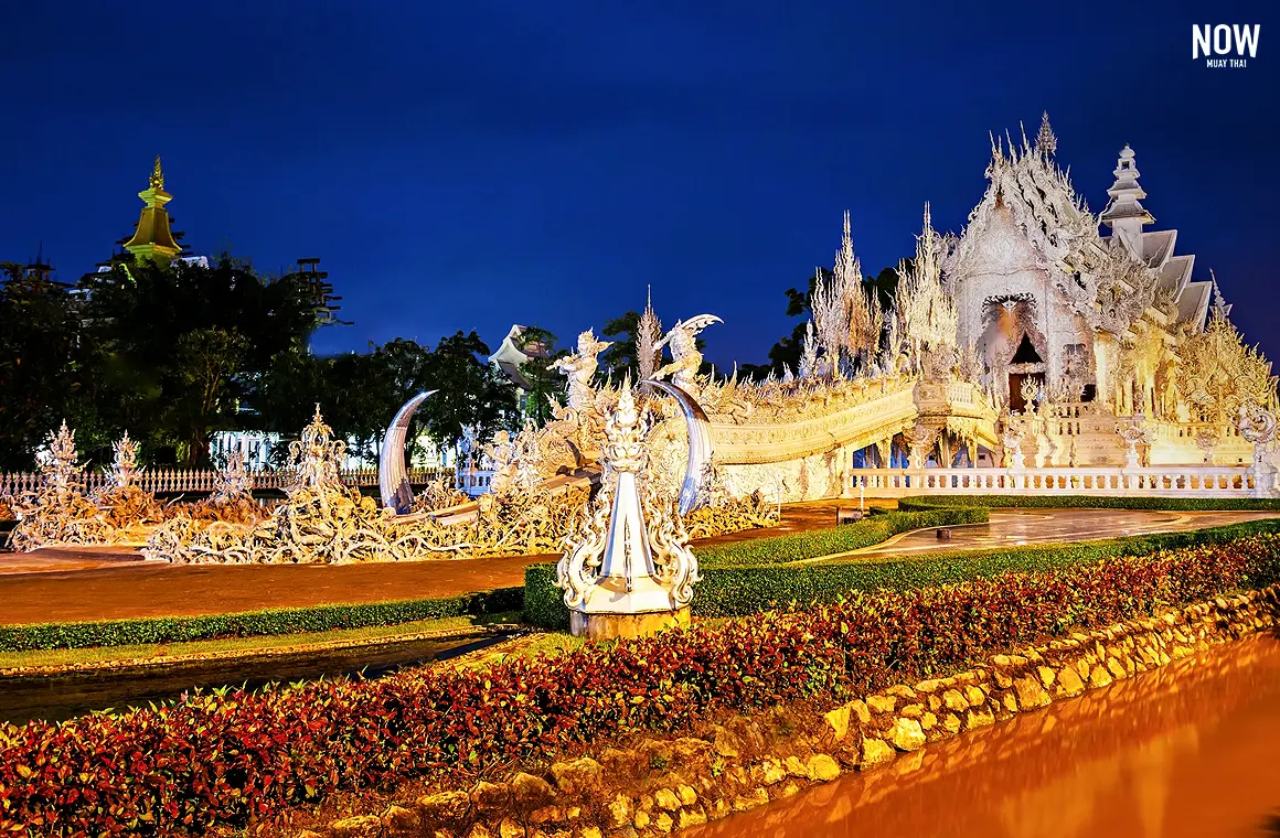 Discover the breathtaking beauty of Wat Rong Khun (White Temple) in Chiang Rai, Thailand, as the sunset casts a golden glow over this architectural masterpiece. A must-visit destination for culture and art enthusiasts. 