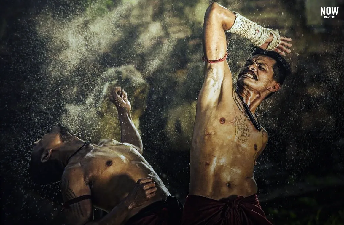 Two fighters engaging in combat using Muay Boran techniques, an ancient martial art from Thailand’s early wars, showcasing the origins of Muay Thai as practiced by Siamese soldiers centuries ago