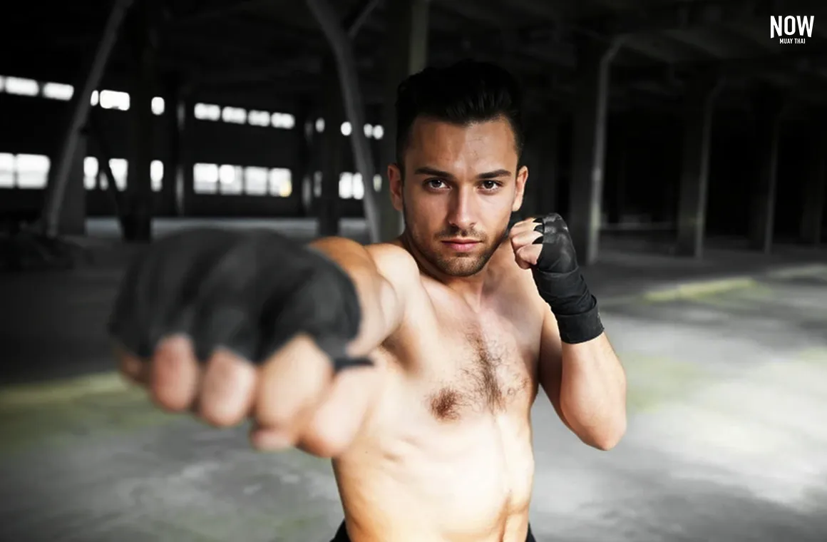 A beginner practices basic Muay Thai punches, focusing on the “straight punch” technique. This involves using coordinated strength from the shoulder, torso, hips, and grounded footwork to drive power toward the target. Mastering this technique is key for developing strong, effective punches in Muay Thai. 