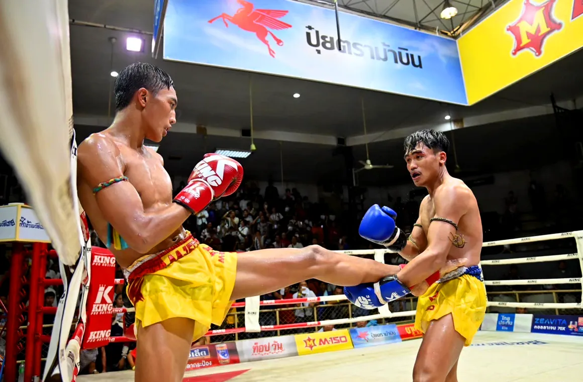 Muay Thai Fighter warming up before a fight at Siam Omnoi Boxing Stadium
