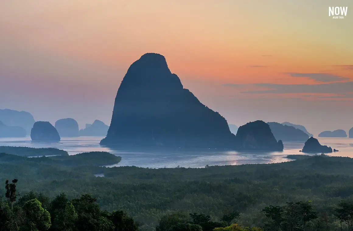 Breathtaking sunset over Phang Nga Bay, captured from Samet Nangshe Viewpoint in Thailand, showcasing the stunning limestone karsts and serene beauty of the bay.