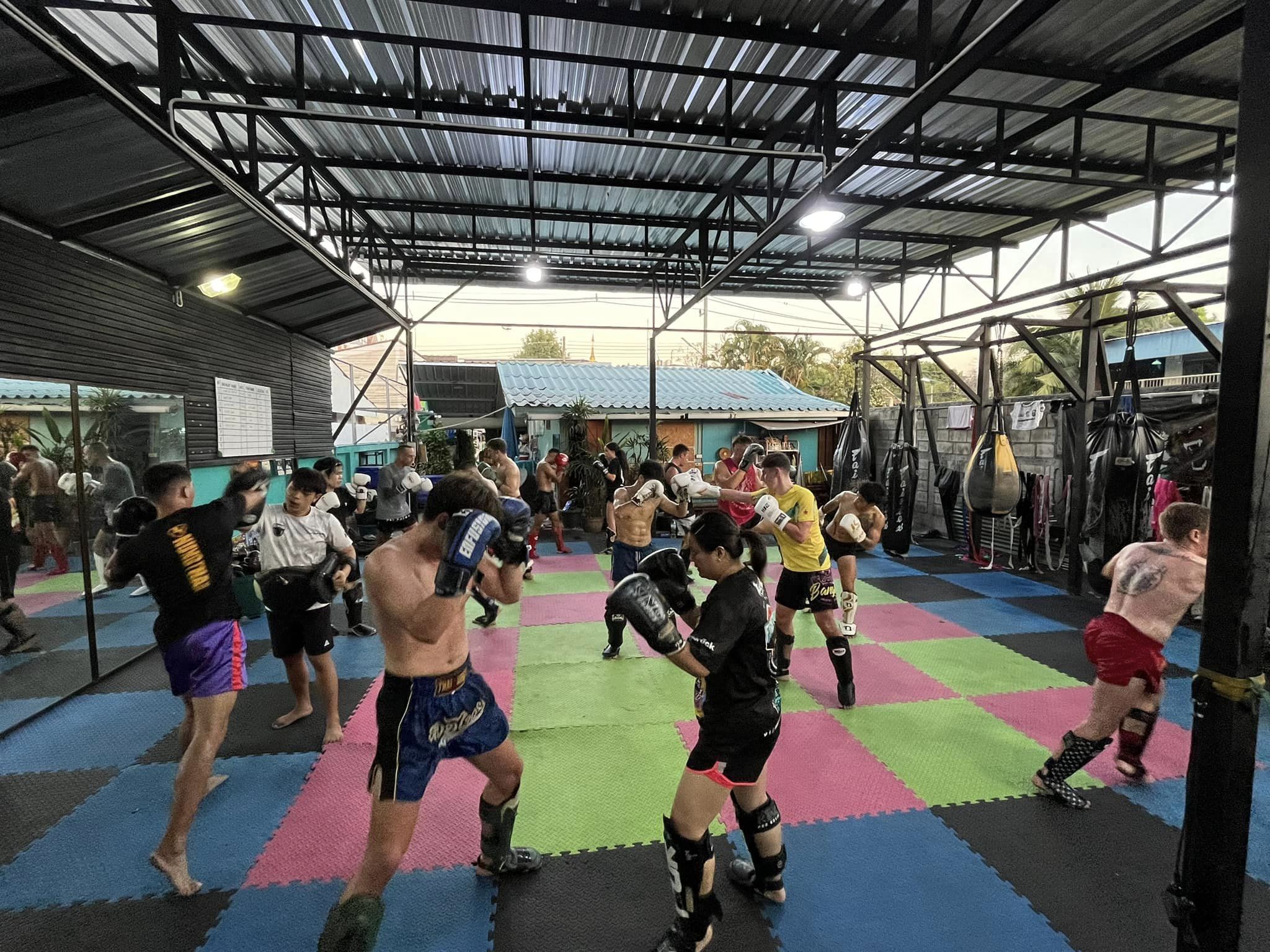People doing fitness exercises at the Bear Fight Club Muay Thai Gym in Chiang Mai