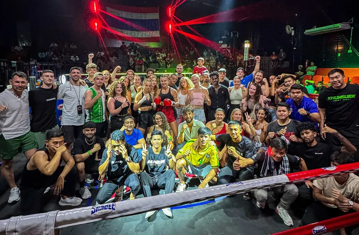 Cheering for a classmate from your Muay Thai class, sharing the energy, the nerves, and the victory—an unforgettable experience together.