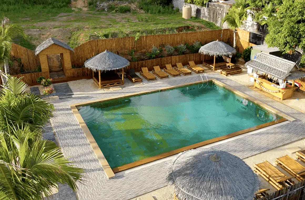 The resort-style pool at AKA Thailand offers the perfect space for post-training recovery in a peaceful tropical setting.