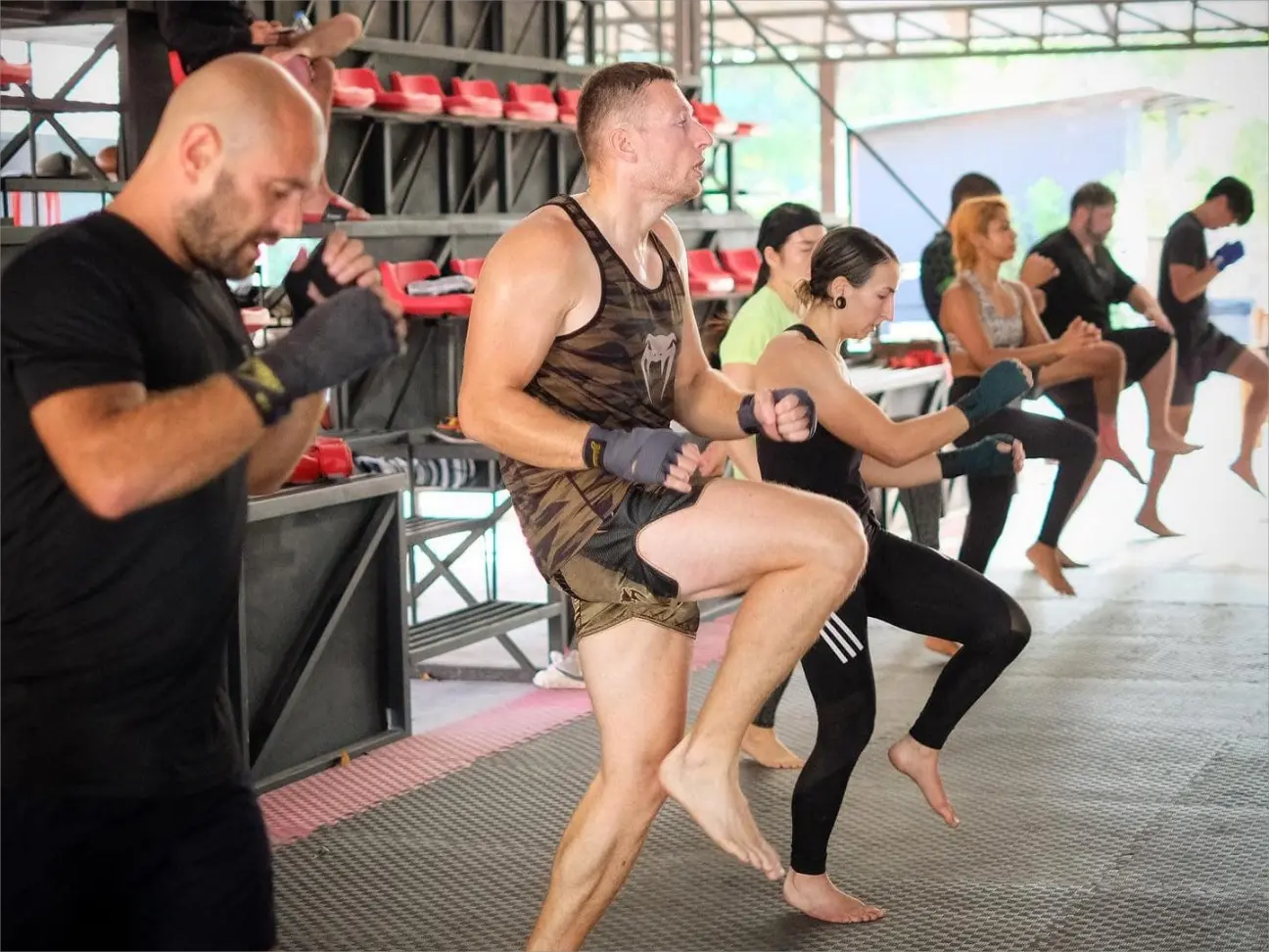 Muay Thai students during warm-up and endurance training at Elite Fight Club Hua Hin.
