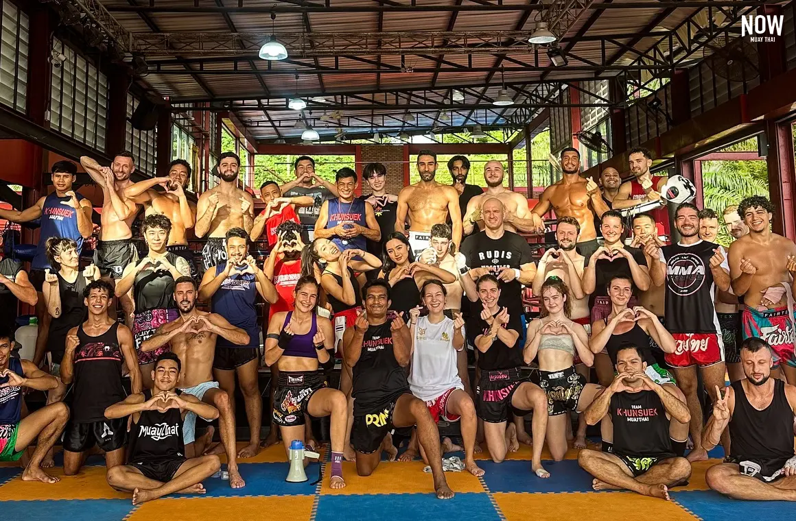 A group of people training Muay Thai at a training camp in Thailand.